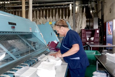 A worker cleaning laundry